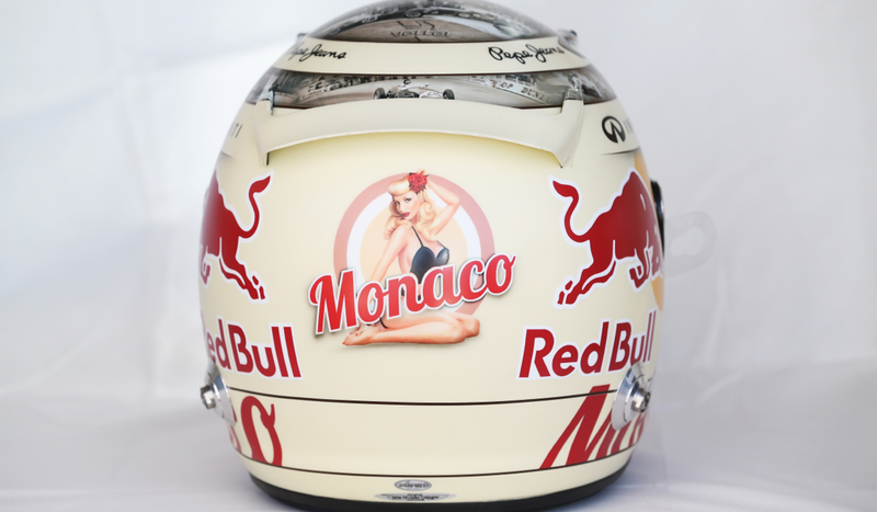 Illustration for article titled Sebastian Vettel's Monaco Helmet Reveals A Naked Pinup When Heated